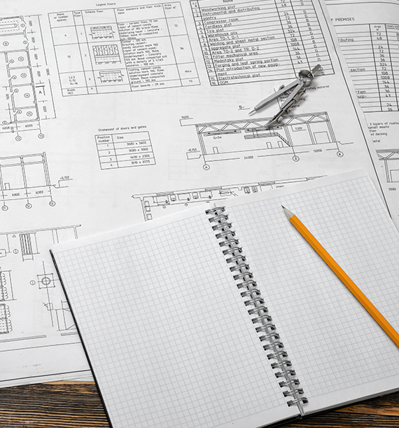 Note book and pencil on-top of a desk